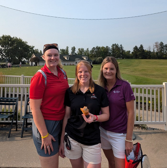 three golfers enjoying breakfast before they get on the course